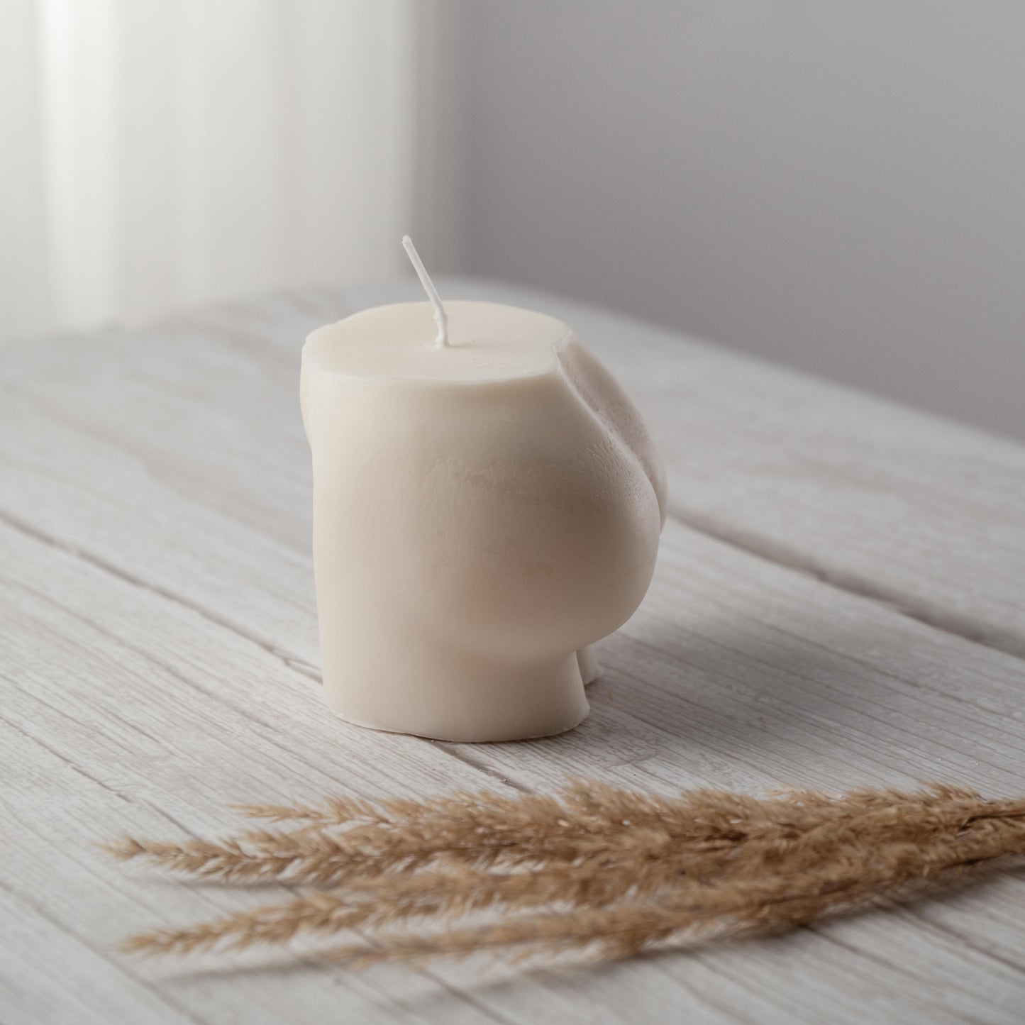 Hand-poured bum candle sculpture, sustainable decorative piece